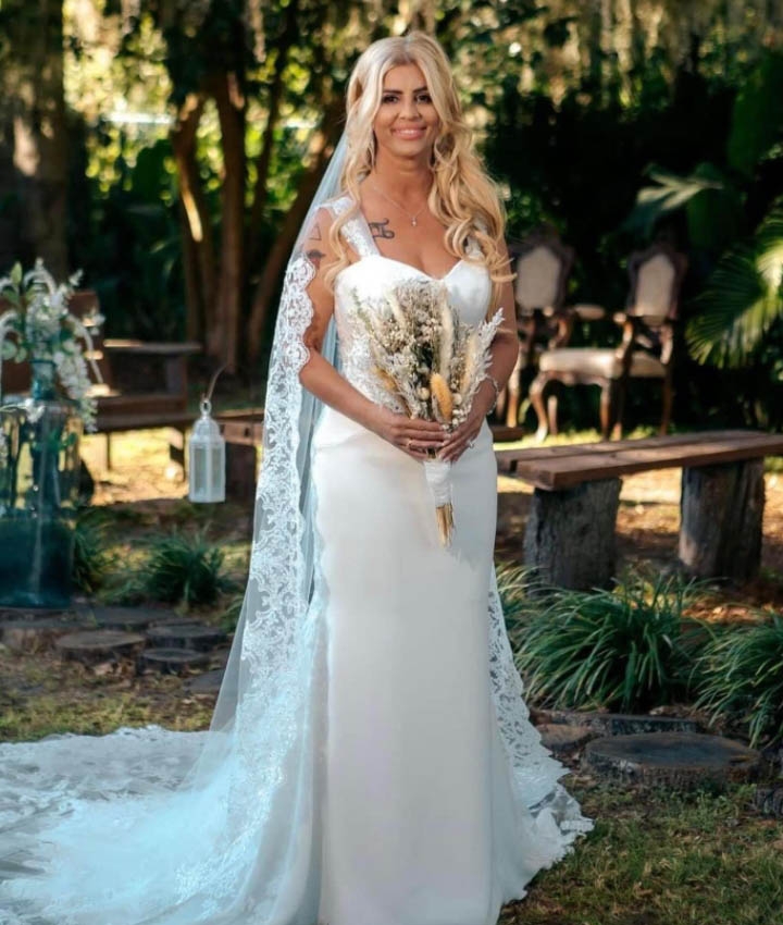 Photo of the real bride in a white gown